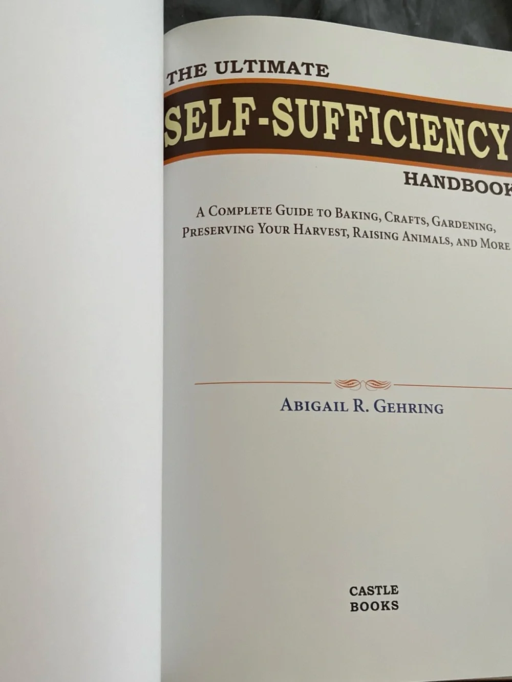 The Ultimate Self-Sufficiency Handbook by Abigail R. Gehring - Green & Red Cover